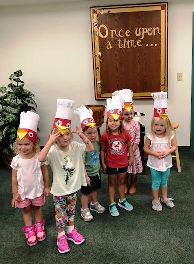 little kids with hen hats